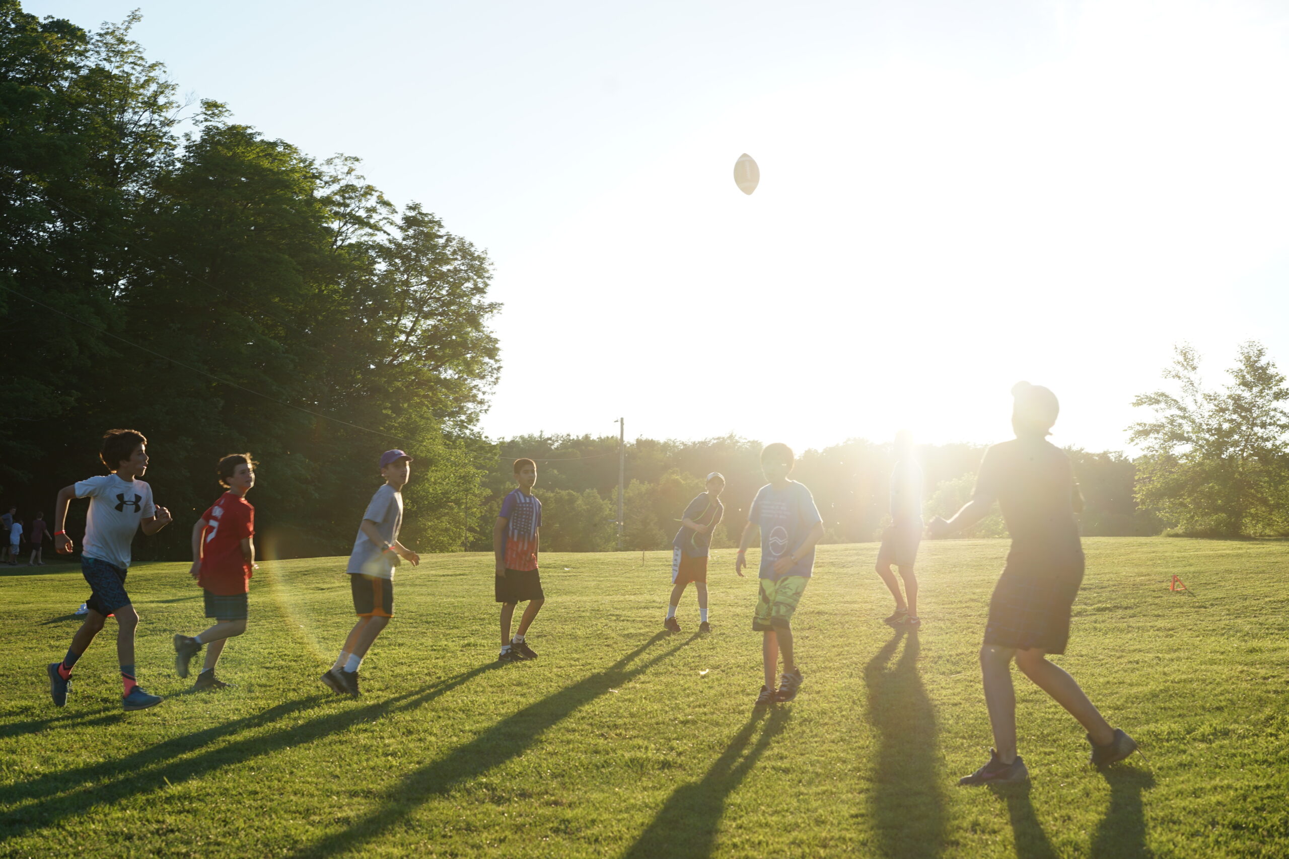 Campers playing football at Camp Manitou