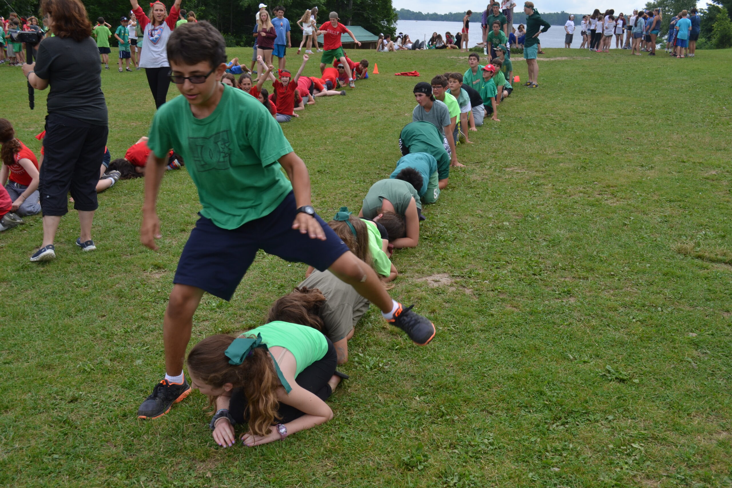 Campers playing leap frog