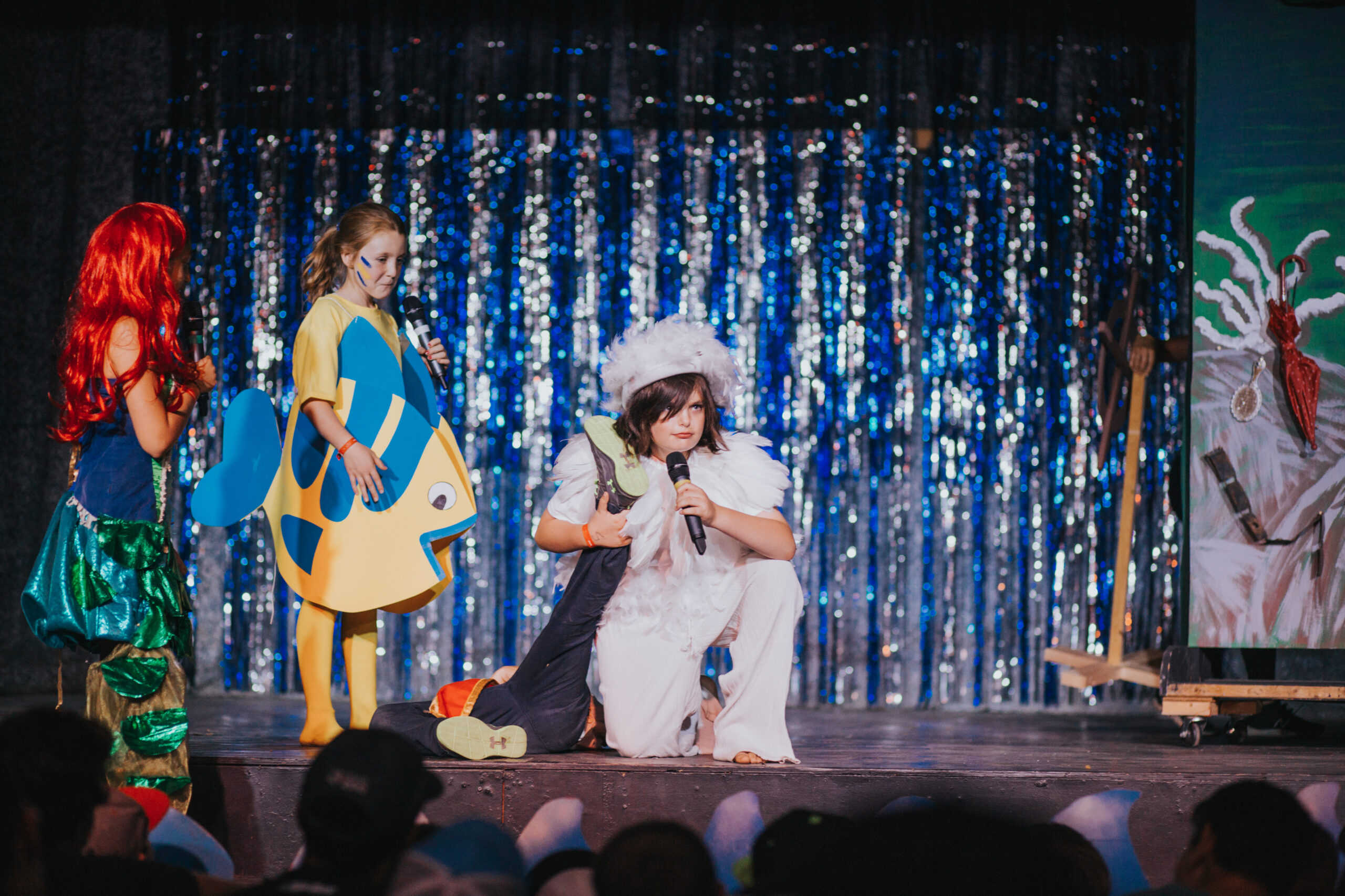 Campers putting on a show of The Little Mermaid